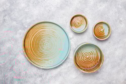 Preview: Different ceramic empty plates and bowls.