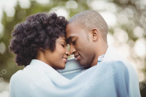 Preview: Peaceful couple standing nose to nose in the garden
