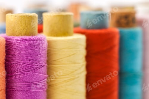 Preview: Reels or spools of multicolored sewing threads. Threads of all colors.