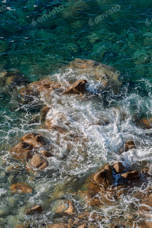 Preview: Waves on rocky beach, sea shore with waves crushing over the big rocks