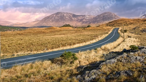 Preview: Beautiful landscape scenery, empty road trough nature with mountains in background at Connemara nati