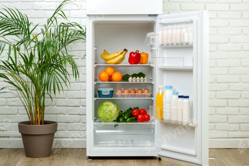 Preview: White Refrigerator Open With Fresh Produce and Dairy