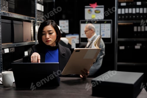 Preview: Asian manager accountant checking profit