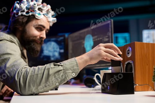 Preview: Engineer with EEG headset inserting cartridge into PC
