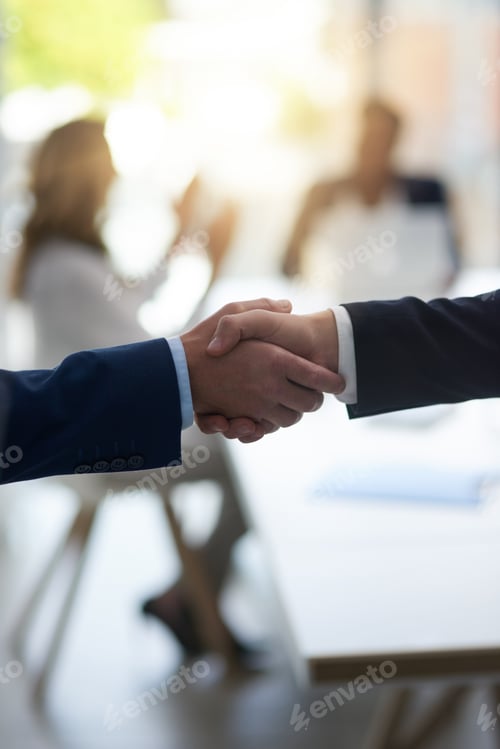 Preview: Shot of two unrecognisable businesspeople shaking hands in an office