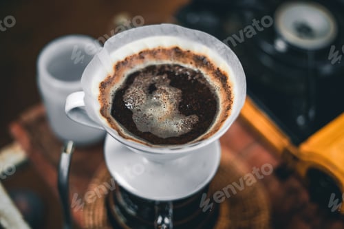 Preview: Drip coffee on a table in a coffee shop dark tone