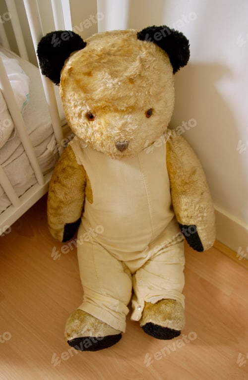 Preview: Vintage old large stuffed teddy bear sitting on the floor