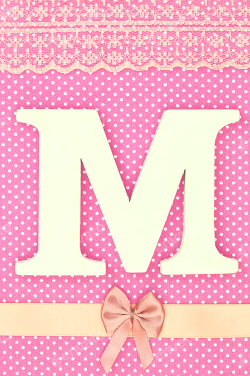 Preview: Wooden letter M on polka dots background