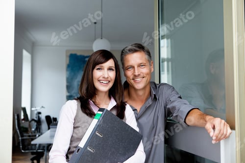 Preview: Business partners smiling to camera