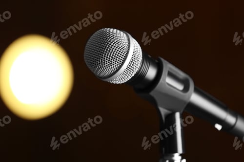 Preview: Microphone against festive lights, space for text
