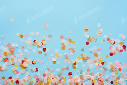 Preview: top view of multicolored confetti on blue