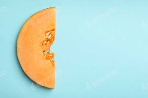 Aperçu: Melon slice on blue background, space for text