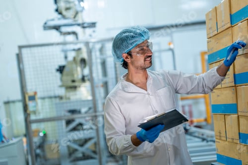 Preview: scientist inspecting seafood product processing in a clean factory.