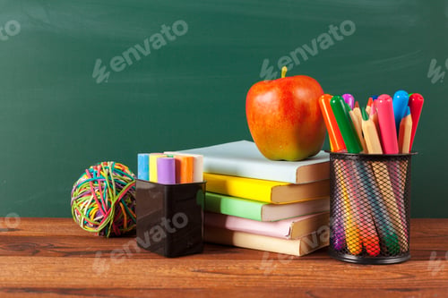 Preview: back to school - apple and books with pencils and blackboard