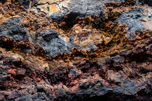 Preview: Detail of the red and yellow colors in the volcanic stones in Charco Manso on the island El Hierro