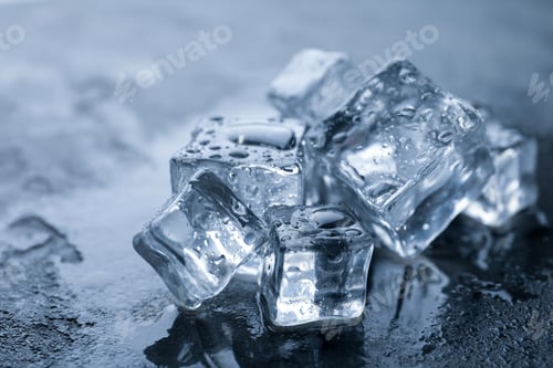 Preview: Crystal clear ice cubes with water drops on grey table, closeup
