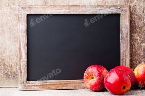 Preview: Christmas chalkboard and decoration over wooden background.