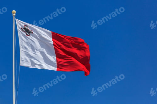 Preview: Malta flag. Malta flag on a pole waving on blue sky background
