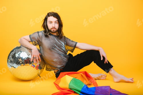 Preview: Handsome young man with pride movement LGBT Rainbow flag