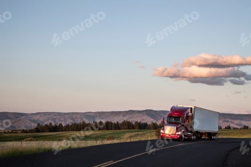 Preview: truck on a highway through the grasslands area of eastern Washington, USA.
