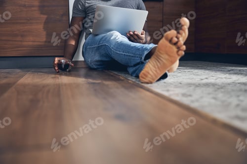 Preview: Close up of international man that sitting on the floor