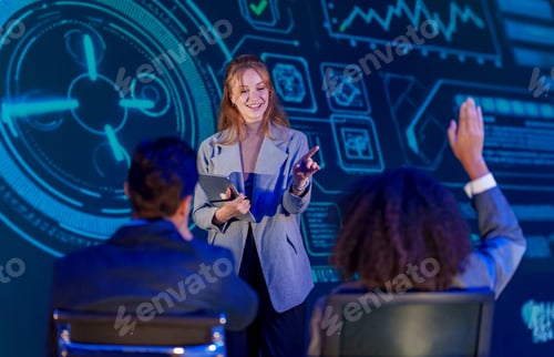 Preview: Woman Answering Colleagues Question while Giving Talk on AI for Business