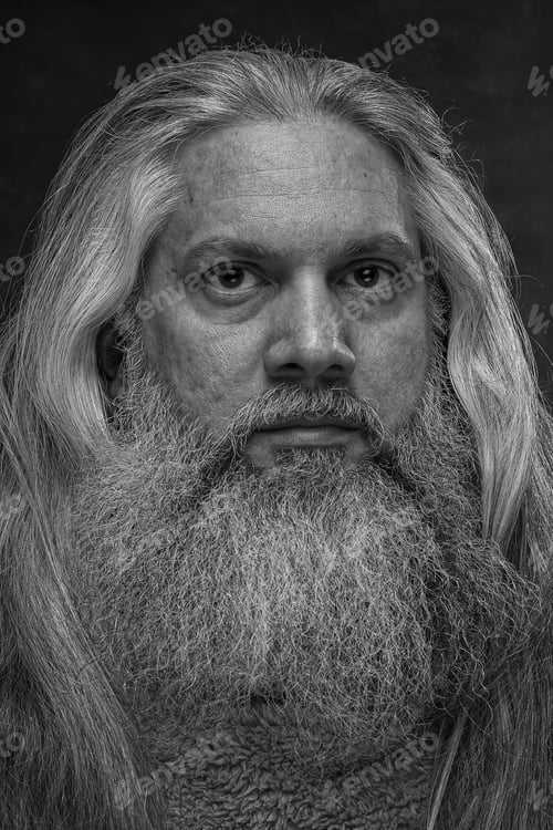 Preview: Self-portrait of bearded man with intense gaze straight ahead.