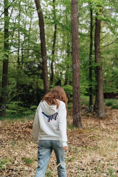 Preview: teenager gen z girl walking in the forest. close to nature concept
