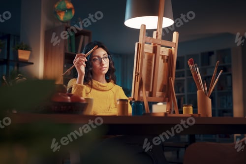 Preview: Young artist painting at home