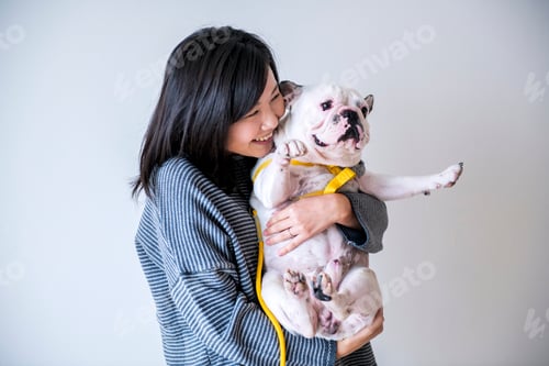Preview: Asian woman hugging dog