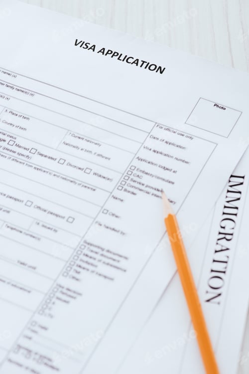 Preview: pencil near documents with visa application and immigration lettering