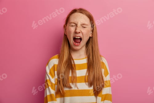 Preview: Emotive small child screams loudly, closes eyes and opens mouth widely, has panic, feels stressed, w