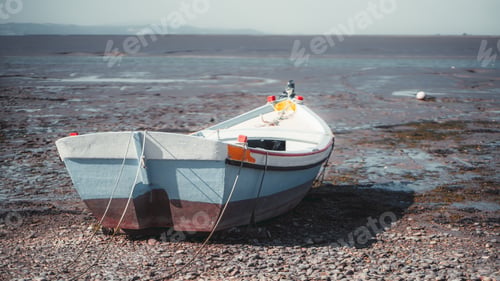 Preview: A colorful boat on the river bank