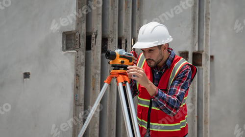 Preview: Civil or construction engineer using a survey camera, or an engineer with an auto level camera.