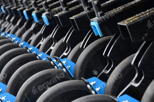 Preview: Row of wheels of the new industrial agricultural seeder close up