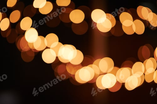 Preview: Brighten up your life. Shot of bright lights blurred in the background of a dark setting.