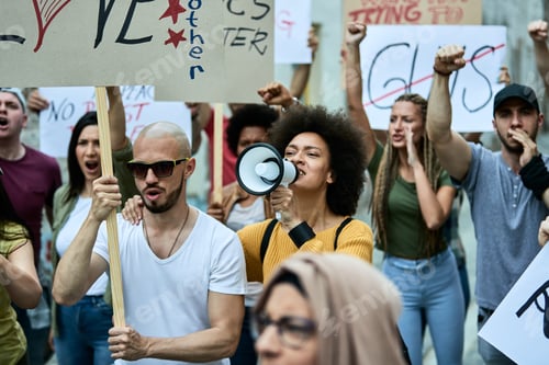 Preview: Multi-ethnic group of people protesting against racial discrimination on the streets.