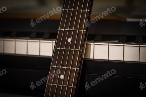 Preview: musical instruments piano keys and acoustic guitar