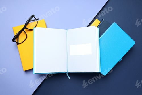 Preview: An open book with glasses on a blue background