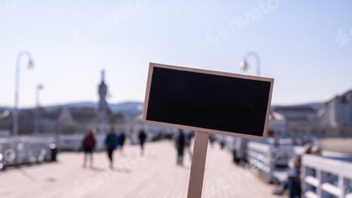 Preview: Blank Black billboard against Crowds of tourists The Sopot Pier in the city on the Baltic Sea. Empty