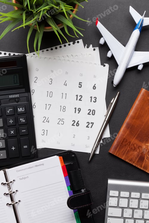 Preview: Business trip concept. Accessories on desk table