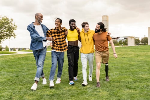 Preview: Group of diverse young men having fun in the city park while walking - Multi ethnic male friends