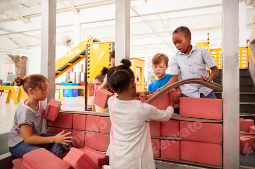 Preview: School kids building with toy bricks at a science centre
