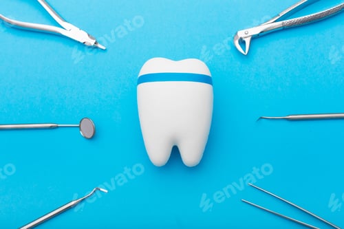 Preview: dentist tools around the tooth, orange background, peach color