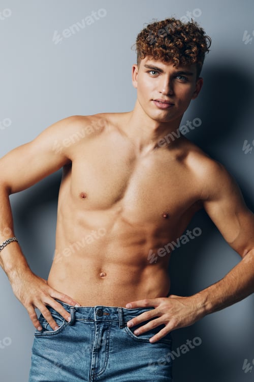 Preview: man care athletic sexy model gray background handsome person beauty adult male jeans