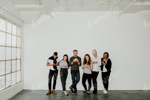 Preview: People Standing and Using Smartphones in Minimalist Room