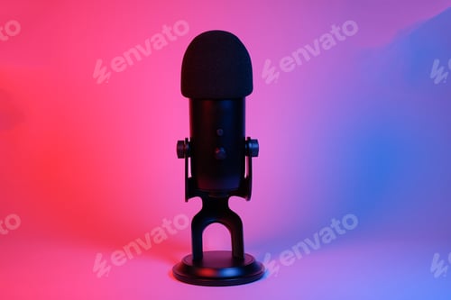 Preview: a black microphone on black background under the neon light.