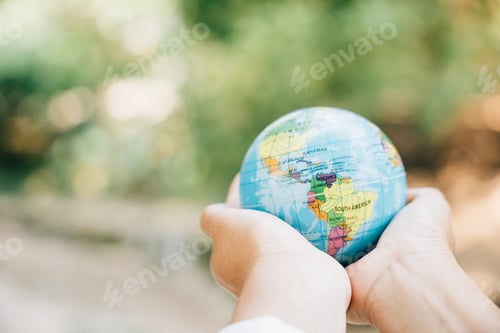 Preview: Embrace the Green Planet in your hands, signifying Earth's preservation. This concept for