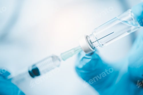 Preview: Doctor with syringe ready for injection of vaccine to patient. Vaccination concept.