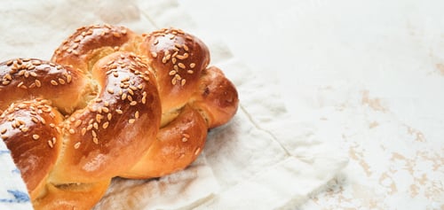 Preview: Challah bread. Sabbath kiddush ceremony composition. Freshly baked homemade braided challah bread fo